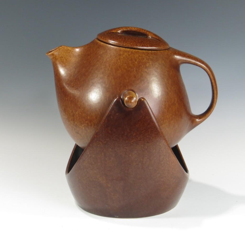 Raymor Roseville U.S.A. Swing Coffee Pot: Raymor Roseville U.S.A. Swing Coffee Pot. Marked Raymor Roseville U.S.A. Shallow chip rim of coffee pot. Looking at the glaze it appear to have been factory. Displays well as chip is hidden by lid. 12