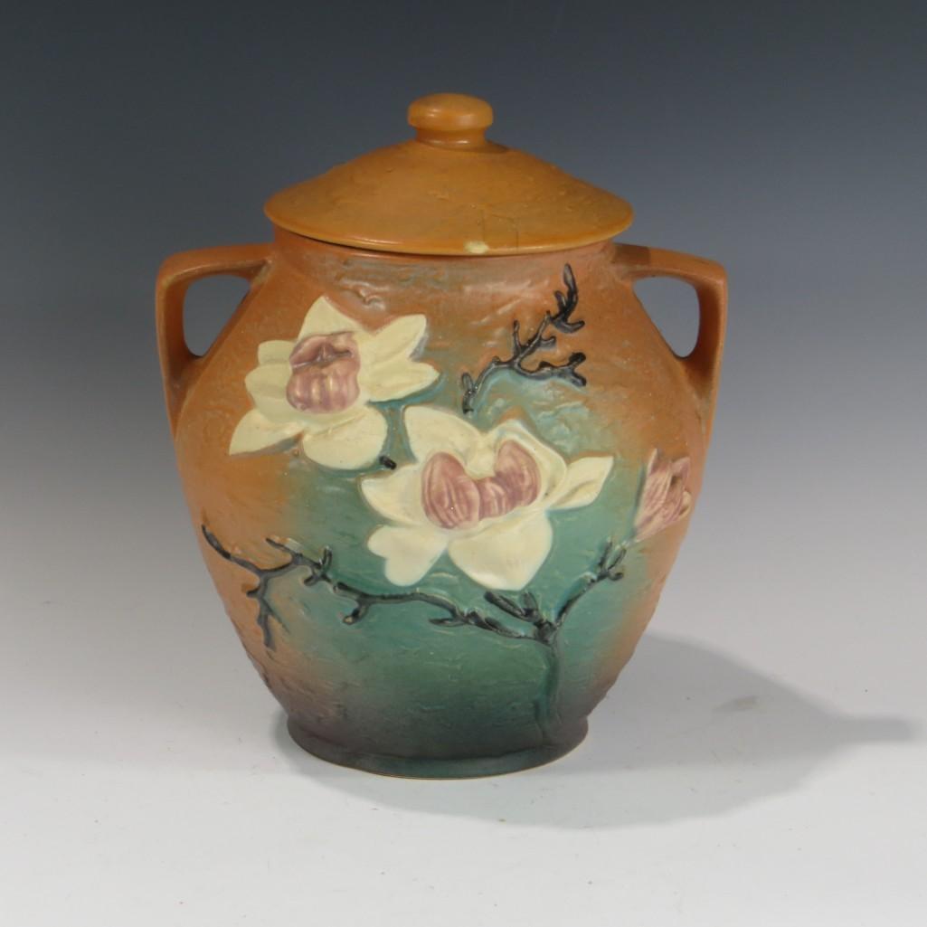Roseville Water Lily Cookie Jar: Roseville Water Lily Cookie Jar. Marked Roseville U.S.A. 1-8". Deteriorating restoration to lid. 10" tall, 8" wide.