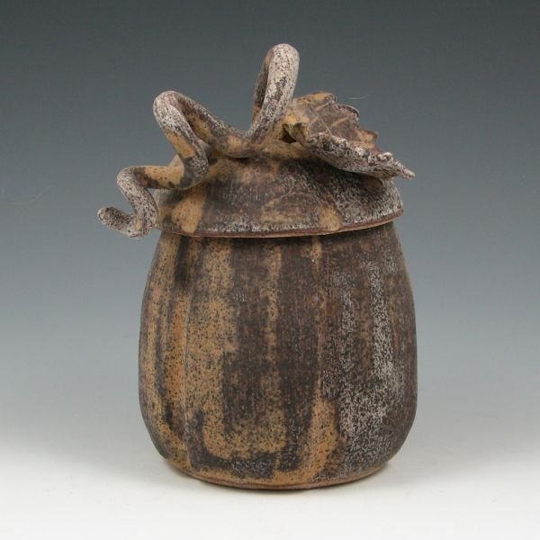 Rae Marie Crisel Lidded Pumpkin Vessel - Mint: Rae Marie Crisel lidded pumpkin vessel. While the piece appears unfinished, it has been glazed to give it the raw stoneware appearance. Signed RMC. Mint. 7 3/8" tall.