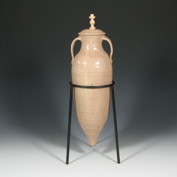 Walt Schmidt 18" Amphora Jar - Mint: Walt Schmidt amphora jar with lid and metal stand. Signed Schmidt and marked with an impressed mark. Mint. Pottery portion is 14 1/2" tall with an overall height of 18".