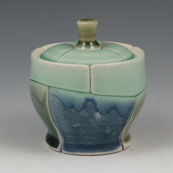 Jeff Campana 3 5/8" Lidded Vessel - Mint: Jeff Campana lidded vessel in blue and green. Jeff's work is noteworthy with strong lines, which are made by dissecting each pot and then reassembling it. Marked JC. Mint. 3 5/8" tall.