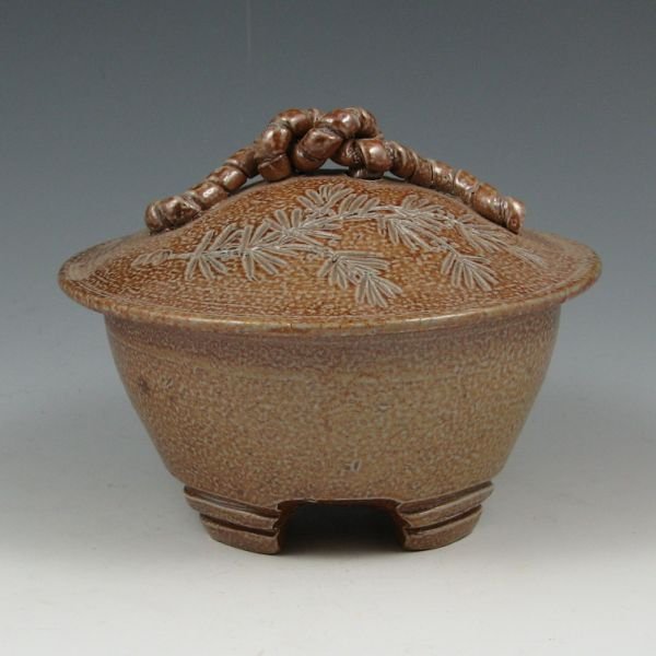 John Peterson 4 1/4" Lidded Vessel - Mint: John Peterson lidded vessel with incised decoration on the lid. Marked JP. Mint. 4 1/4" tall by 5 1/2" wide.
