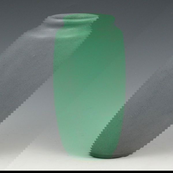 Teco Arts & Crafts Matte Green 6 1/8" Vase: Teco Arts & Crafts vase in nicely textured matte green glaze. Marked with impressed Teco stamp (twice). There is a very tight hairline that descends from the rim to the shoulder. 6 1/8" tall.