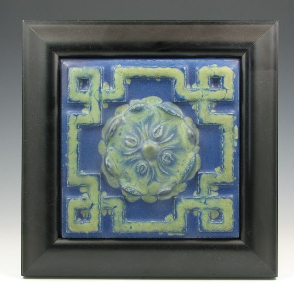 Rookwood Faience Framed Tile: Rookwood Faience tile with bright blue and matte green coloration. Framed in contemporary black frame. Marked Rookwood Faience 1166Y4. Some areas of professional restoration to high points of the desi
