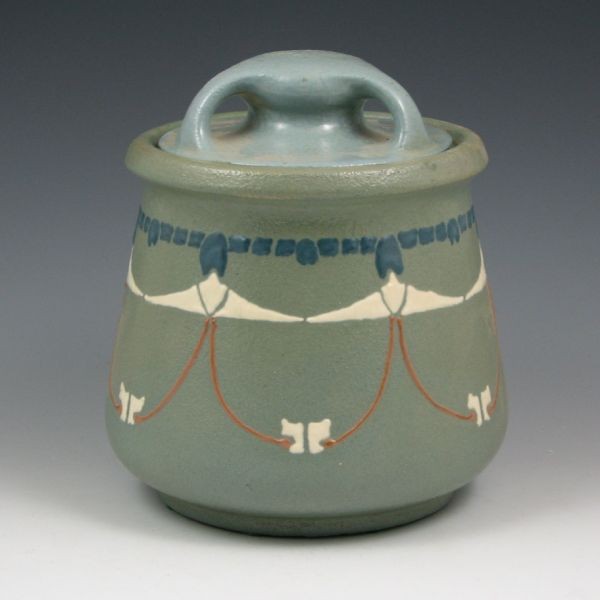 Roseville Aztec 7" Humidor w/ Lid: Roseville Aztec lidded humidor with slip-trail decoration. Marked with Rozane Ware wafer. There is a professional restoration to a chip on the inside rim of the jar. Also, while the lid is mint and fr