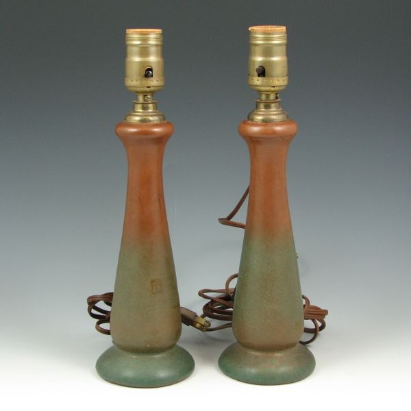 Van Briggle 1920s Mountain Craig Lamps: Pair of Van Briggle lamps in Mountain Craig glaze, made circa 1922 to 1926. Marked Van Briggle with logo, USA. There appears to be some damage to the pottery around the rim where the lamp fixtures hav