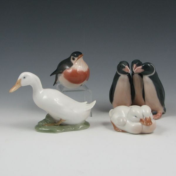 Royal Copenhagen Ducks, Robin & Penguins - Mint: Four pieces of Royal Copenhagen including a #1192 duck, #516 pair of ducks, #2266 robin and a #1284 penguin trio. All marked. All mint. 1 3/4" to 3 3/4" tall.