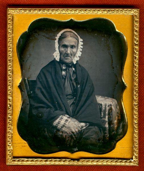 West Virginia pioneer daguerreotype: 1/6 plate daguerreotype of an identified early West Virginia resident. Resealed, Grade 4, small mat abrasions with a barely noticeable, old, tarnished-over partial finger print in the lower left. In h