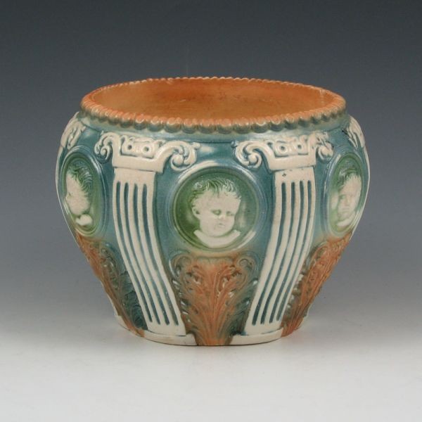 Roseville Cherub Cameo 584-5" Jardiniere: Roseville Cherub Cameo 584-5" jardiniere. Unmarked. Minute nick to rim. 6 3/4" wide by 4 3/4" tall. Provenance: Gordon & Sue Hoppe Collection.