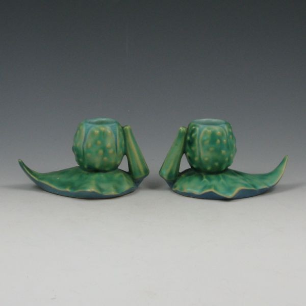 Roseville Thornapple #1117 Candleholders - Mint: Roseville Thornapple candleholders in blue. Marked Roseville 1117. Mint (very hard to find without damage). 4 1/2" long by 2 3/8" tall. Provenance: Gordon & Sue Hoppe Collection.
