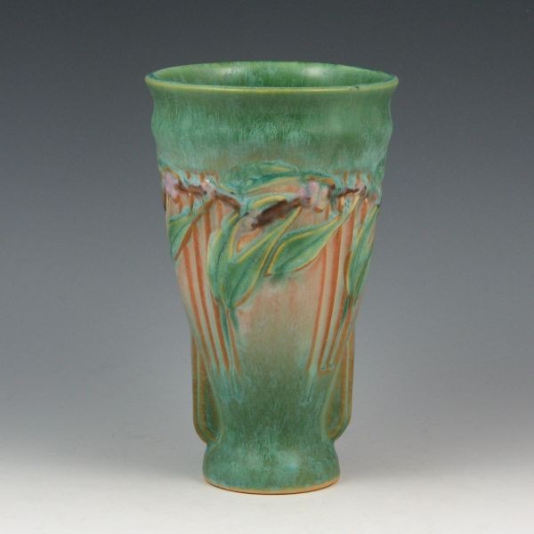 Roseville Laurel 669-6 1/2" Vase - Mint w/ Label: Roseville green Laurel 669-6 1/2" vase. Marked 669 in red crayon and with an original foil label. Mint. 6 5/8" tall. Provenance: Gordon & Sue Hoppe Collection.
