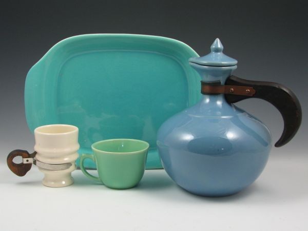 Bauer & Metlox Four-Piece Grouping - Excellent: Four-piece lot of pottery include a cup, serving tray and beverage pitcher by Bauer and a Metlox Poppytrail cup. All marked. All excellent. Largest dimension is 12 3/4".