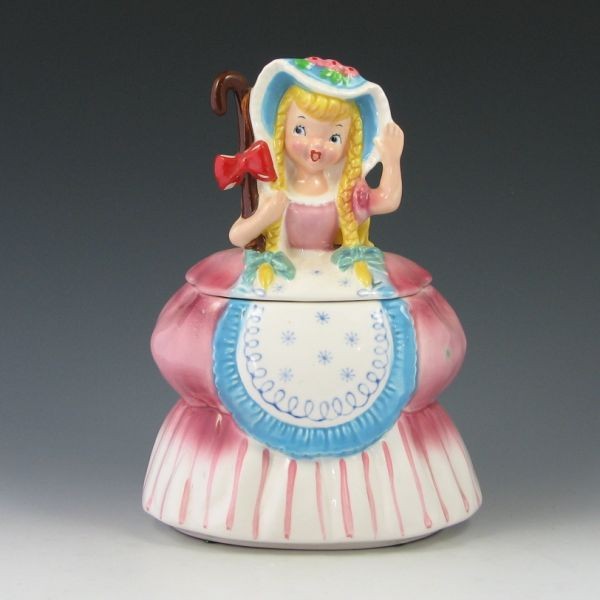 Napco Little Bo Peep Cookie Jar - Mint: Napco Little Bo Peep cookie jar. Marked JC NAPCO 1957 K2292 with a partial silver label. Mint. 9 1/8" tall.