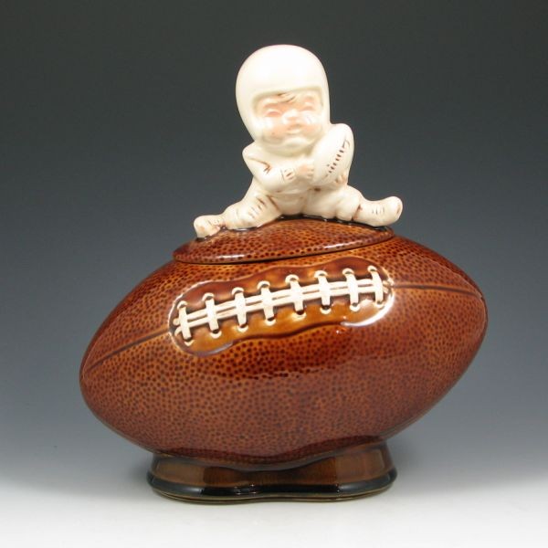 McCoy Boy On Football Cookie Jar - Excellent: McCoy boy on football cookie jar. Marked 222 McCoy USA with Lancaster Colony mark. Excellent condition. 11 1/2" tall.