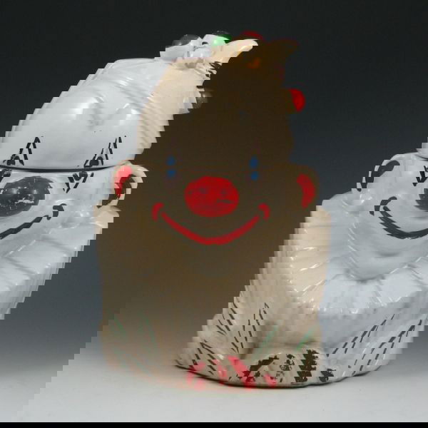 McCoy Clown Bust Cookie Jar: McCoy clown bust cookie jar. Marked McCoy. No damage, but there is stained crazing to the interior and bottom and loss of cold paint. 10 1/2" tall.