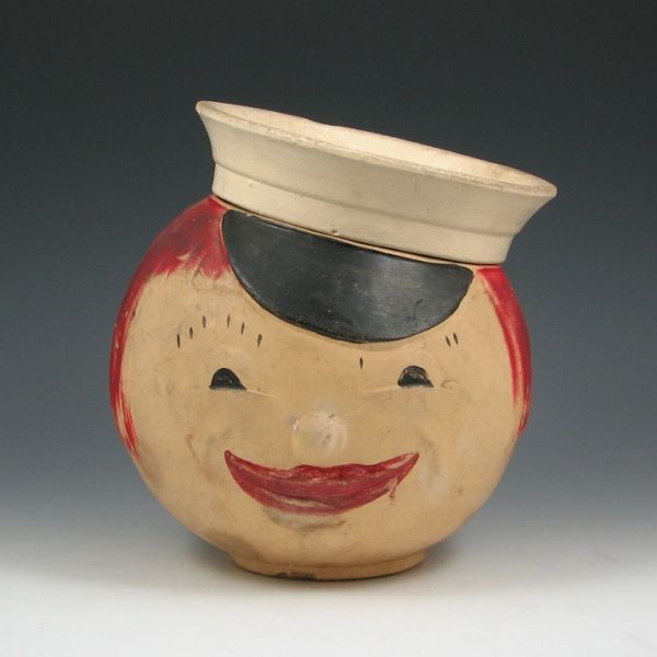 American Bisque Wave Sailor Cookie Jar: American Bisque wave sailor cookie jar. Unmarked. Couple of minor nicks, discoloration. 9 1/4" tall.
