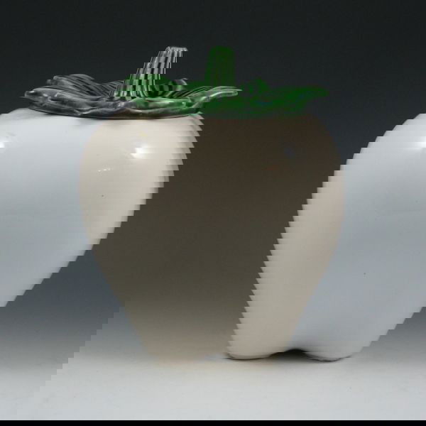 McCoy White Apple Cookie Jar: McCoy white apple cookie jar. Faintly marked with circular McCoy mark. Damage to the lid has been glued back in place. 9 1/2" tall.