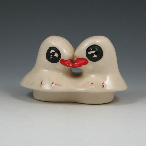 McCoy Lovebirds Cookie Jar Lid: McCoy lovebirds cookie jar lid. Unmarked. Chip to inside of rim. 6 1/4" wide. Outer diameter of insertion sleeve is 4 3/4" wide.