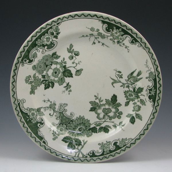 Belleek 10 3/8" Earthenware Plate - 1st Black: Belleek floral earthenware plate with green transfer ware. Marked with green 1st Mark (1863-1890). Chip to backside of plate's rim. 10 3/8" in diameter.