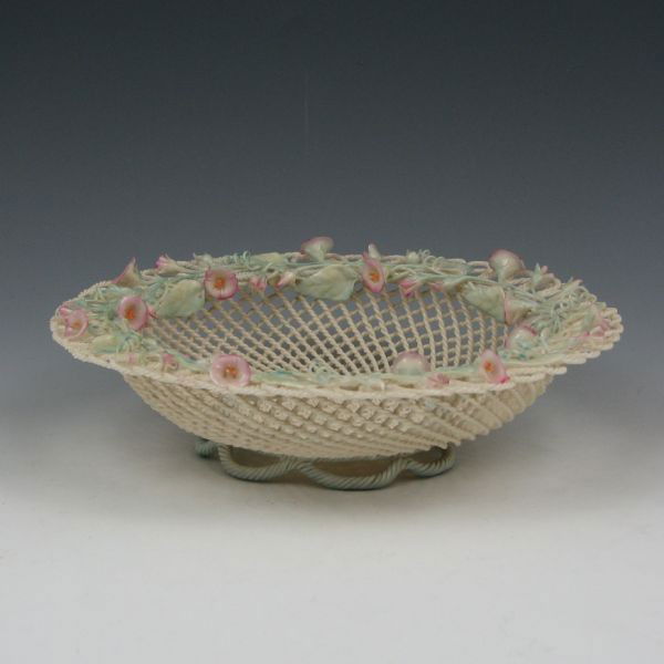 Belleek Two-Strand Colored Basket (1890-1920): Belleek twisted two-strand basket with colored flowers, leaves and accents. Marked Belleek Co. Fermanagh Ireland on a single pad (circa 1890-1920). There is a small chip to one flower, otherwise this