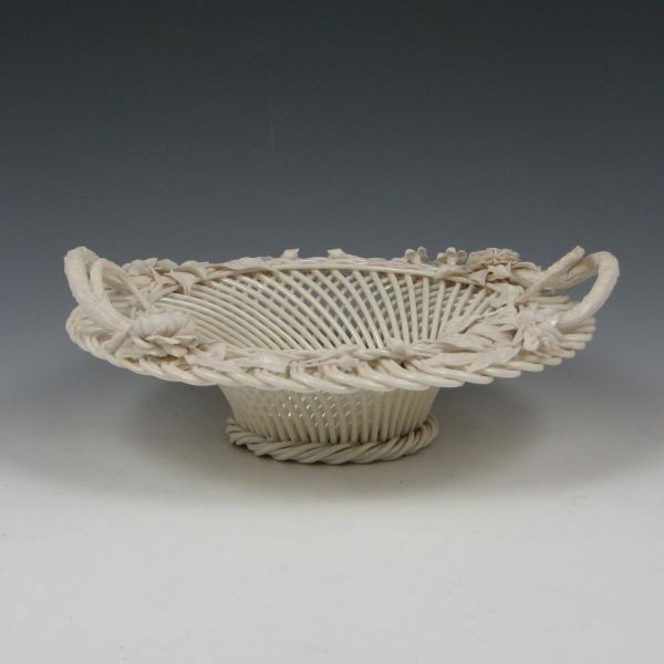 Belleek Two-Strand Floral Basket (1890-1920): Belleek two-strand basket with parian (bisque) finish applied decoration and handles and Mother of Pearl body. Marked Belleek Co. Fermanagh on a single pad (circa 1890-1920). Losses to applied decorat