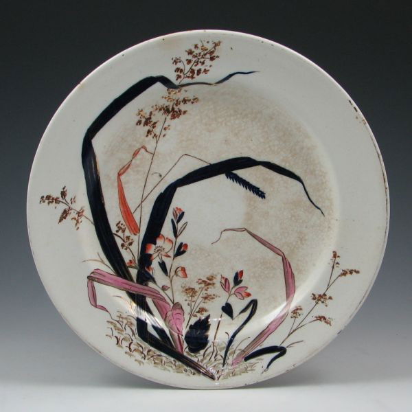 Belleek Earthenware Decorated Plate - 1st Black: Belleek Earthenware plate with Japanese-inspired hand decoration. Marked with black 1st Mark (1863-1890) and impressed harp mark. Stained crazing. 10 3/4" in diameter.