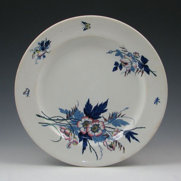 Belleek Earthenware 10 1/2" Plate - 1st Impressed: Belleek Earthenware plate with colorful floral decoration. Marked with impressed 1st Mark (1863-1890), an impressed harp and impressed numbers. No overt damage or repairs, but the top surfaced is scra