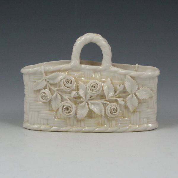 Belleek Floral Straw Basket - 2nd Black: Belleek flowered Straw basket. Cob Lustre accents. Marked with black 2nd Mark (1891-1926). Couple of small losses to applied decoration. 4 1/8" tall by 6 1/8" wide.