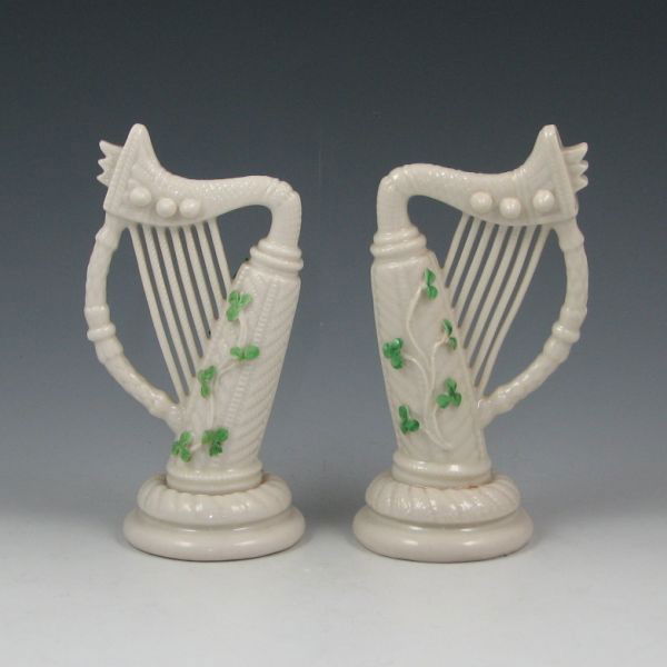 Belleek Shamrock Harps (2) - 2nd Black: Two Belleek Shamrock harps. Both marked with black 2nd Marks (1891-1926). Both have lost segments to the clover leaves. 5 3/4" tall.