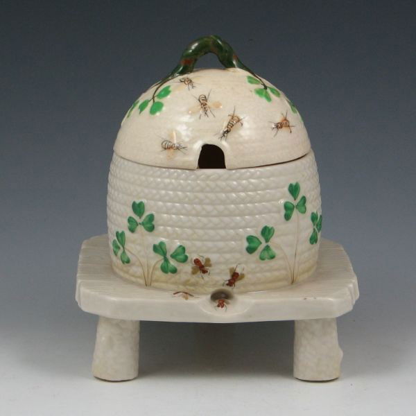 Belleek Shamrock Honey Pot - 3rd Black: Belleek Shamrock honey pot. Marked with black 3rd Mark (1926-1946). The base is mint but the lid is not original and does not appear to even be from the same period as the glaze and color are differen