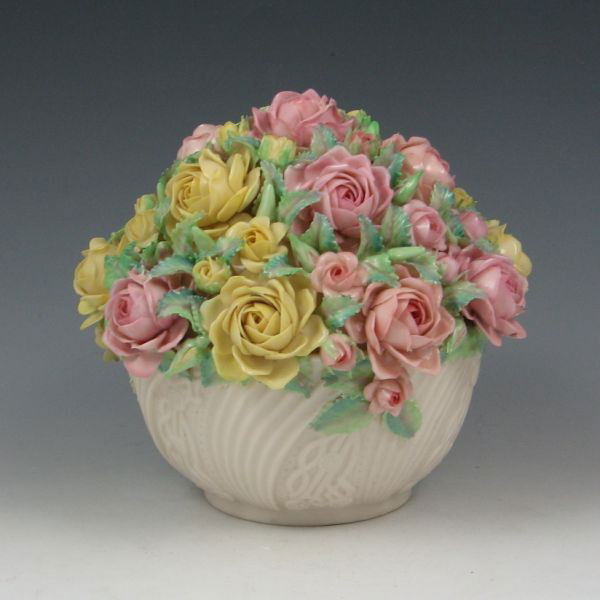 Belleek Rose Bowl - 5th Green: Belleek rose bowl. Marked with green 5th Mark (1955-1965). Three of the large roses around the widest part of the piece have been restored with a couple minor losses remaining. 5 5/8" tall.