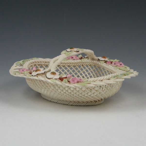 Belleek Degenhardt Basket In Box - 8th Blue: Limited edition Belleek Degenhardt basket in original box. Marked with blue 8th Mark (1993-1998), No. 113-97 F (by the decorator) with Richard Degenhardt's signature. Mint. 8 1/2" wide by 3 3/4" tall.