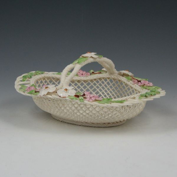 Belleek Degenhardt Basket In Box - 8th Blue: Limited edition Belleek Degenhardt basket in original box. Marked with blue 8th Mark (1993-1998), No. 274-95 S (by the decorator) with Richard Degenhardt's signature. Mint. 8 1/2" wide by 3 3/4" tall.