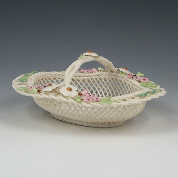 Belleek Degenhardt Basket - 8th Blue: Limited edition Belleek Degenhardt basket. Marked with blue 8th Mark (1993-1998), No. 411-95 D (by the decorator) with Richard Degenhardt's signature. Mint. 8 3/4" wide by 3 3/4" tall.