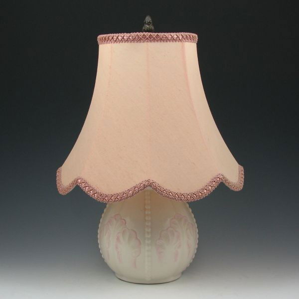 Belleek Rossmore Lamp - Blue Ribbon: Belleek Rossmore lamp with shade and pink tint. Marked with blue Belleek Ireland mark at the base and with an original label on green felt on the bottom. Mint. Porcelain portion is 6 1/2" tall with an