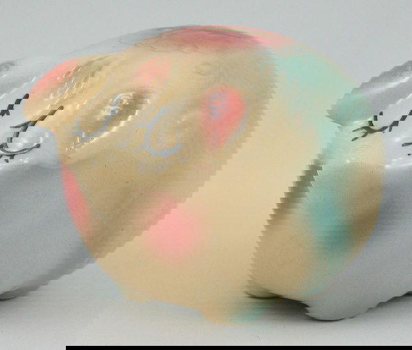 Hull Pottery Assoc. '96 Commem. Corky Bank - Mint: Hull Pottery Association commemorative piece from 1996, a small Corky Pig bank. Marked on USA HP 58 on the base and HPS 96 on the "rear." Mint. 3 1/4" tall by 4 1/2" long.