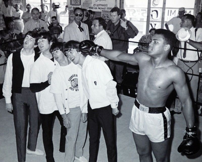 Ali With The Beatles by Unknown Artist - Memorabilia: "Ali With The Beatles" by Unknown Artist - Memorabilia Item - Photography. This Memorabilia Item measures approx. 15.75H x 19.5W Inches as shown. This item has been certified authentic and ships with 