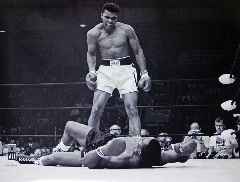 Muhammad Ali Over Sonny Liston by Unknown Artist -: "Muhammad Ali Over Sonny Liston" by Unknown Artist - Memorabilia Item - Sports Icons. This Memorabilia Item measures approx. 30H x 40W Inches as shown. This item has been certified authentic and ships