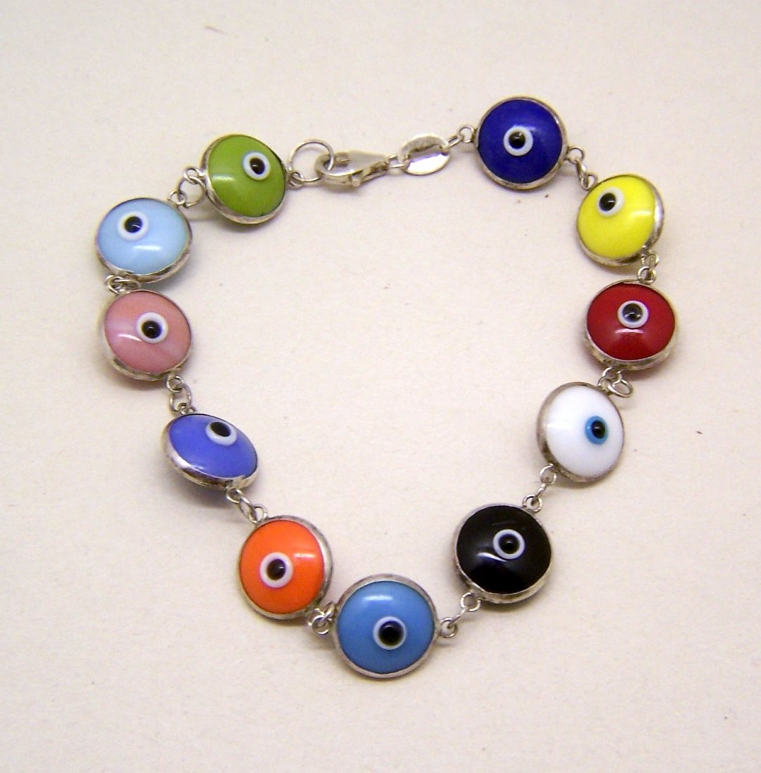 sterling silver lamp work glass evil eye bracelet: measures 7 3/8" long by 3/8" wide, weights 7.2 grams, marked 925 in great condition