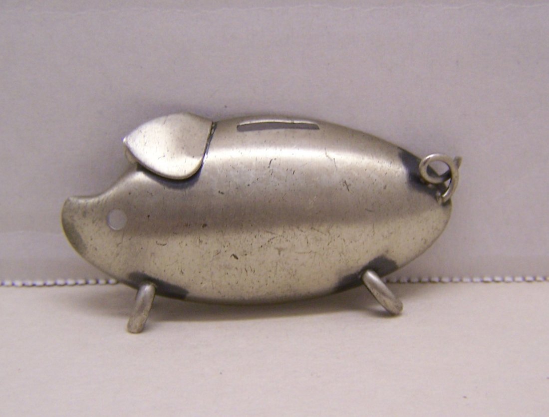 vintage BEAU sterling silver piggy bank brooch pin: measures 2 1/8" long by 1 3/16" wide, weights 8.4 grams, marked Beau sterling, in great condition.