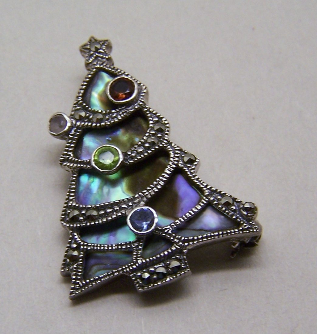 sterling silver abalone topaz garnet peridot brooch pin: measures 1 5/16" long by 9/16" wide, crafted with 26x19mm abalone & 2mm amethyst, 2mm to 3mm peridot, blue topaz, garnet, weights 5.4 grams, signed 925, in great condition.
