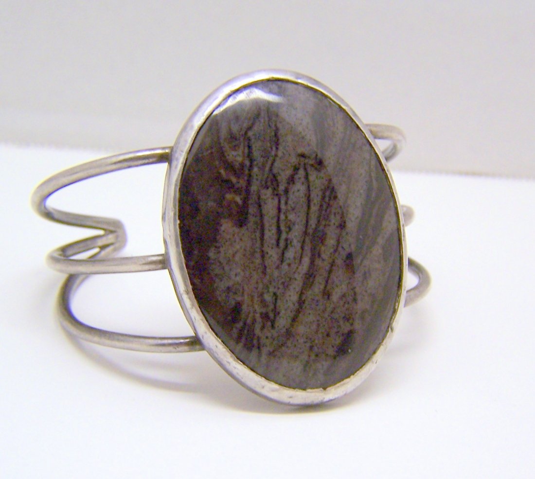 NAVAJO sterling silver jasper stone cuff bracelet: the bracelet can fit a 6 1/2" to 8" wrist by 2 1/8" wide, crafted with 50x38mm oval shape jasper, weights 50.6 grams, note the bracelet is crafted in sterling silver the back of the bezel setting is m