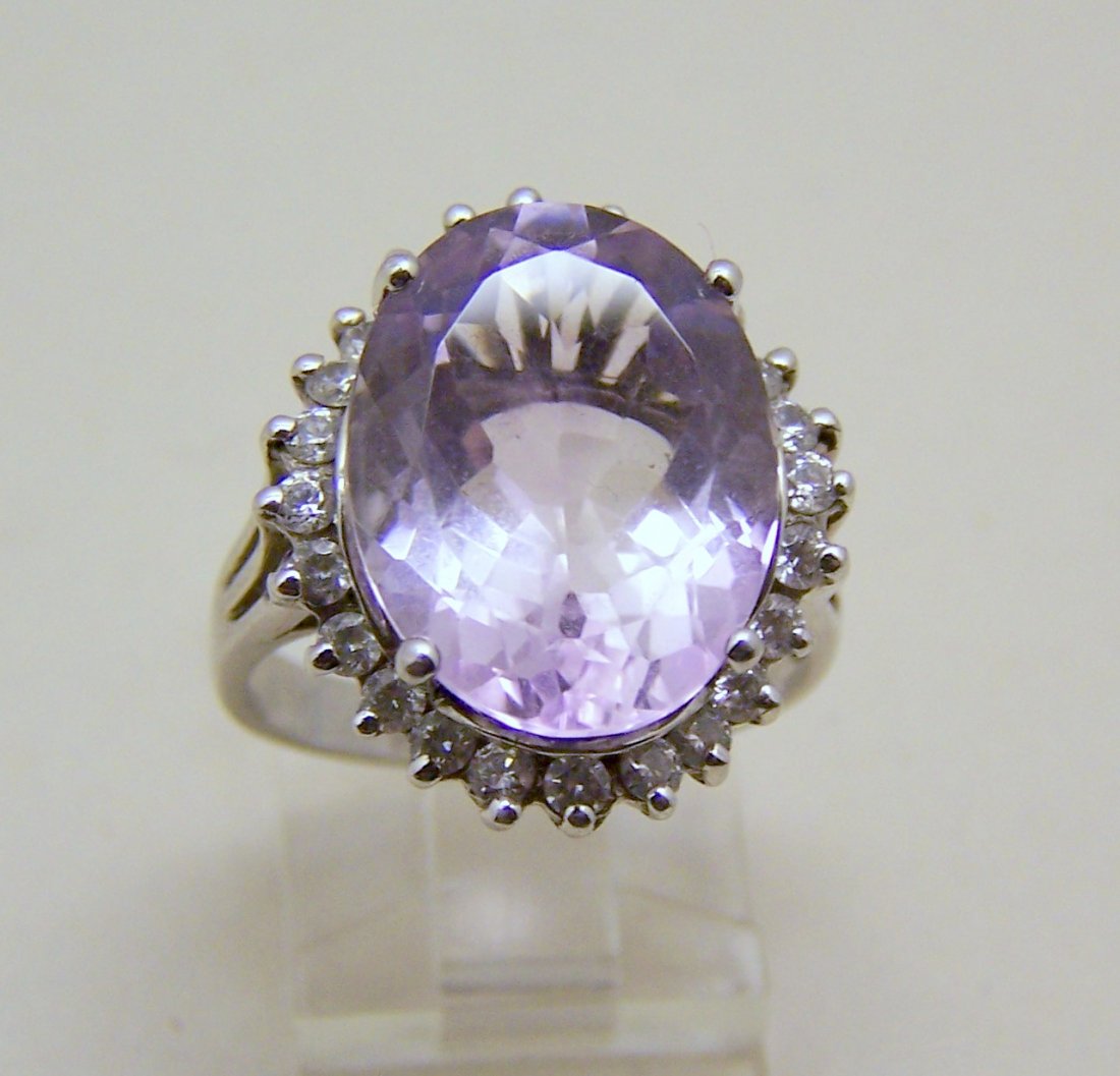 FP sterling silver white Cz amethyst cocktail ring: top of the ring measures 6/8" long by 13/16" wide, crafted with 16x12mm amethyst & 2mm white Cz, sz 9, weights 10 grams, marked 925 FP , in great condition