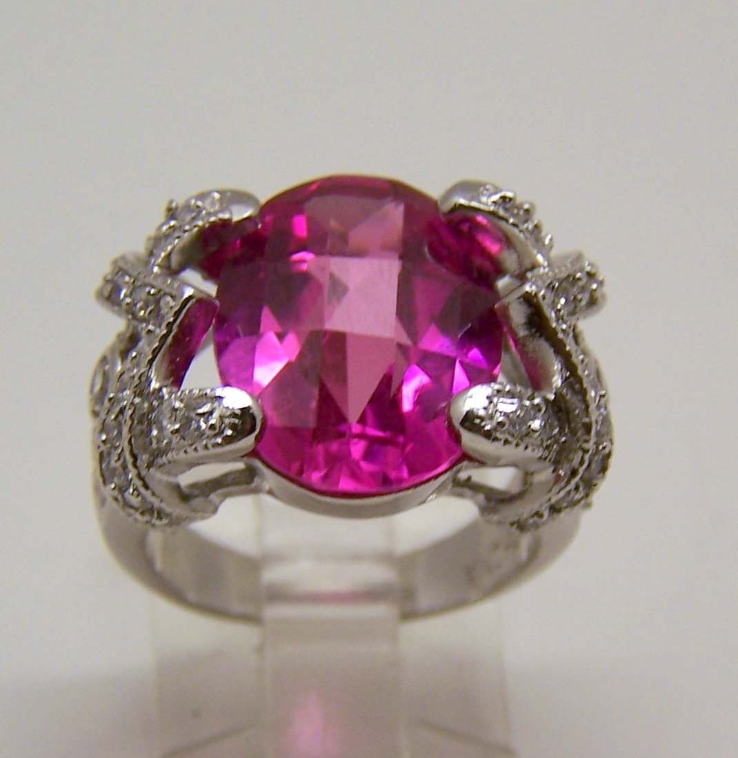 FAS sterling silver Cz cocktail ring: top of the ring measures 7/8" long by 5/8" wide, crafted with 14x12mm pink cz & white Cz, size 6, weights 9.2 grams, signed FAS 925, in great condition.