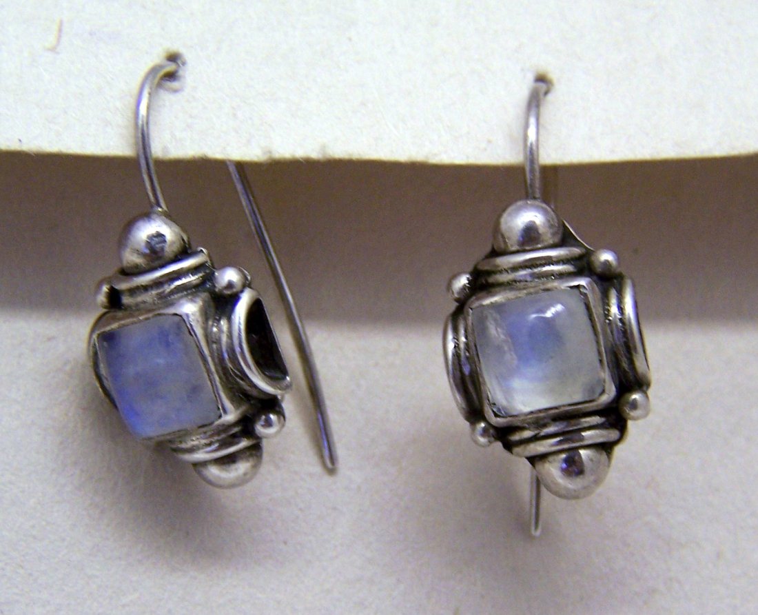 sterling silver moonstone earrings set: measures 1" wide by 7/16" wide, crafted with 6x6mm moonstone, weights 5.43 grams, unmarked but tested as sterling silver.