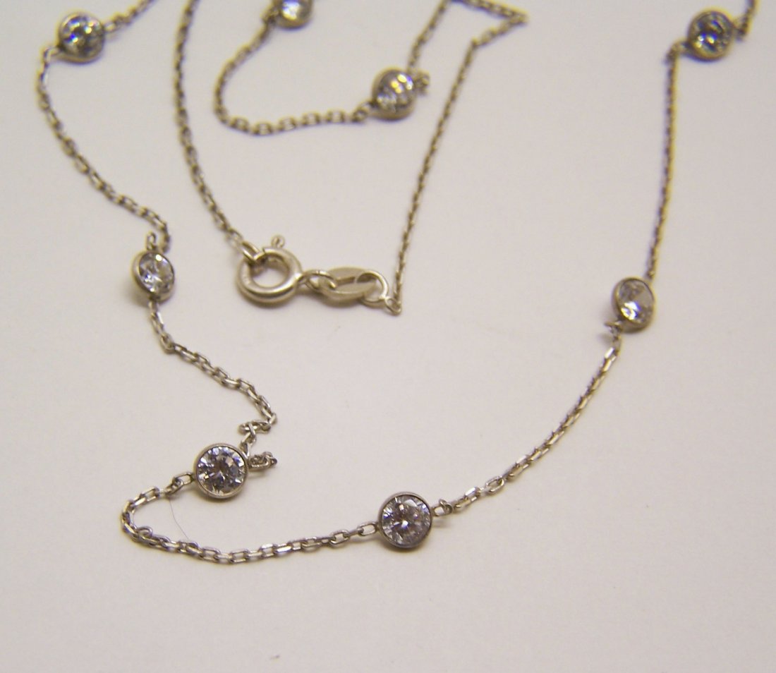 sterling silver diamond by the yard Cz necklace: measures 25" long,crafted with 4mm Cz, weights 3.74 grams, marked 925, in good great condition.