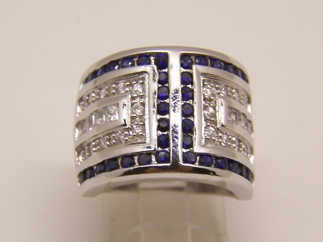 designer signed sterling silver blue & white topaz ring: top of the ring measures 5/8" wide, crafted with 1mm to 1.5mm white & blue topaz, size 7, weights 10.76 grams, signed 925 RS, in great condition.