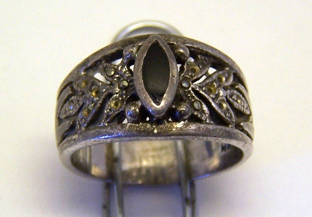 vintage sterling silver onyx marcasite ring: top of the ring measures 7/16" wide, size 6 1/2, weights 6 grams, signed 925MA. in good condition with marcasites missing check pictures for it.