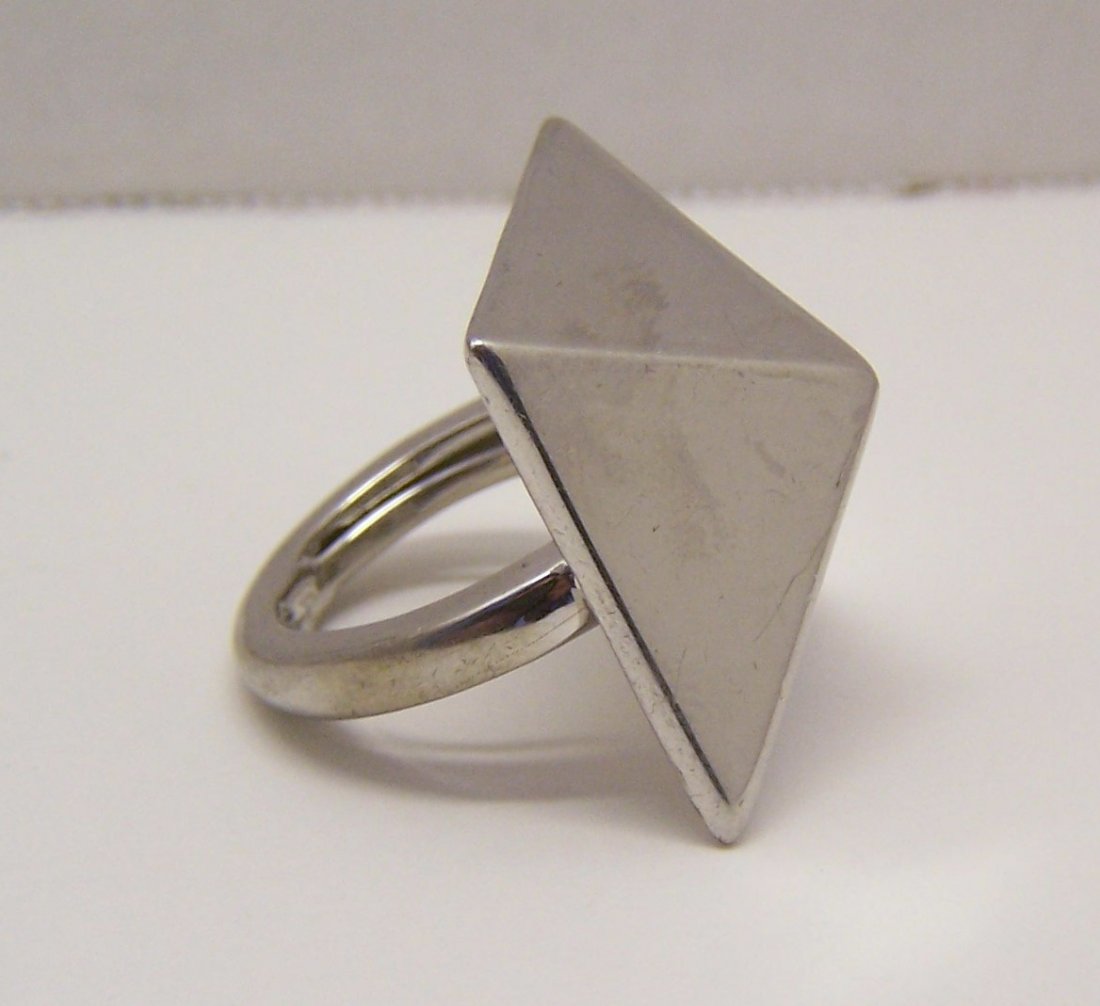 KENNETH JAY LANE pyramid silver tone ring: top of the ring measures 1 1/16" long by 1 1/16" wide, can fit a size 5 1/2 to 7 because of the ring guard, weights 15.37 grams, signed KJL, in great condition