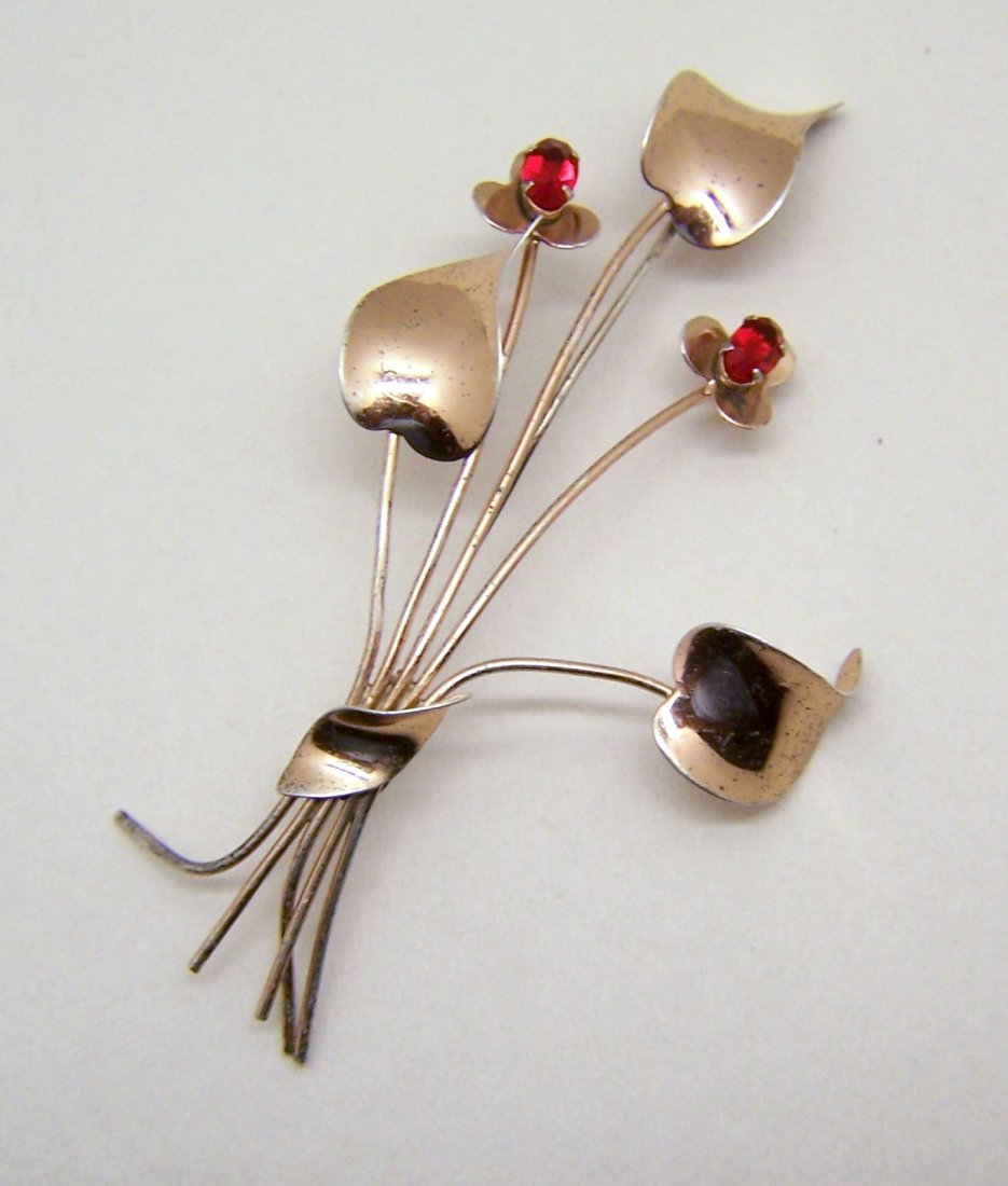 sterling silver by JORDAN ruby rhinestone brooch pin: measures 3 5/16" long by 1 7/8" wide, crafted with 5x4mm ruby rhinestones, weights 6.9 grams, marked sterling by jordan, in good condition.